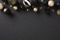 Christmas dark background with luxury golden ball decorations, top view. Xmas greeting card template, Happy New Year banner design Royalty Free Stock Photo