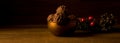 Christmas dark chocolate truffles in golden bowl on wooden background, golden light Royalty Free Stock Photo