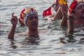 CHRISTMAS DAY HARBOUR SWIM 2015, BARCELONA, Port Vell - 25th December:Swimmers in carnival costumes greet the audience