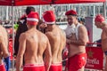 CHRISTMAS DAY HARBOUR SWIM 2015, BARCELONA, Port Vell - 25th December: Swimmers in Santa Claus hats prepared for contest Royalty Free Stock Photo