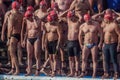 CHRISTMAS DAY HARBOUR SWIM 2015, BARCELONA, Port Vell - 25th December: Swimmers in Santa Claus hats prepared for contest Royalty Free Stock Photo