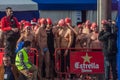 CHRISTMAS DAY HARBOUR SWIM 2015, BARCELONA, Port Vell - 25th December: Swimmers in Santa Claus hats prepared for contest Royalty Free Stock Photo