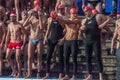 CHRISTMAS DAY HARBOUR SWIM 2015, BARCELONA, Port Vell - 25th December: Swimmers in Santa Claus hats prepared for contest Royalty Free Stock Photo