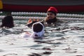 CHRISTMAS DAY HARBOUR SWIM 2015, BARCELONA, Port Vell - 25th December: Swimmers in Santa Claus hats prepared for contest Royalty Free Stock Photo