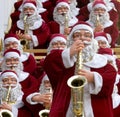 Christmas day:Santa Claus models playing saxophone