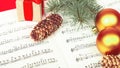 Christmas decor on the background of musical notes Royalty Free Stock Photo