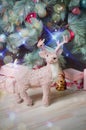 Christmas decor. Christmas tree decorated with toys. Pink deer. New year. Christmas. Festive atmosphere.