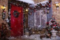 Christmas decor on a patio. Doors are decorated by a festive chaplet and toys. Fir-tree at a window Royalty Free Stock Photo