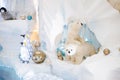 Christmas decor. Polar polar bears and penguins on an artificial iceberg in a cave Royalty Free Stock Photo