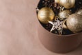 Christmas decor shiny balls, pine cones in a box Royalty Free Stock Photo