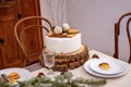 christmas decor on the table and decorative white cake.