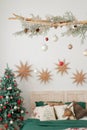 Christmas decorated bedroom in classic green and red colors. Classic Christmas tree decorations Royalty Free Stock Photo