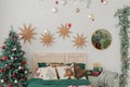 Christmas decorated bedroom in classic green and red colors. Classic Christmas tree decorations Royalty Free Stock Photo