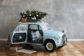 Christmas decorated classic car. A vintage car decorated for New year holidays loaded with festive gifts. Christmas