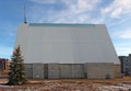 Christmas decorated fir tree placed near unfinished new Catholic church in PilaitÃâ residential area