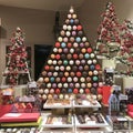 Christmas decorated pastry shop with macaroons, biscuits, chocolate boxes and candies.