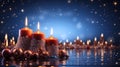 Christmas decorated red candles and ornaments on blue glittering sky background, Christmas and winter, season greeting concept Royalty Free Stock Photo