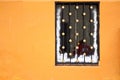 Christmas decorated window on orange wall Royalty Free Stock Photo