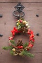 Christmas decorated wreath in an antique wooden door. France