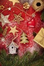Christmas decorating elements and ornament on rustic red wood table Royalty Free Stock Photo