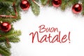 Christmas decoration background with Christmas greeting in Italian `Buone Natale!`
