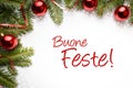 Christmas decoration background with holiday greeting in Italian `Buone Feste`!