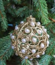 Christmas decoration ball with pearls on tree Royalty Free Stock Photo