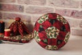 Christmas decoration ball sewn from pieces of fabrics, sewing accessories, traditional patchwork Royalty Free Stock Photo