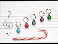 Christmas decoration balls are arranged on a piece of paper like music notes Royalty Free Stock Photo