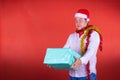 Christmas boifriend with present red background poses isolated