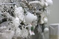Christmas decoration balls on white snow tree