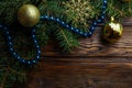 Christmas decoration baubles with branches of fir tree on wooden background Royalty Free Stock Photo