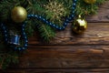 Christmas decoration baubles with branches of fir tree on wooden background Royalty Free Stock Photo
