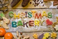 Christmas decoration and biscuit letters on wood, christmas bake Royalty Free Stock Photo