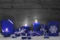 Christmas Decoration With Blue Candles, Presents And Snow Royalty Free Stock Photo