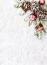 Christmas decoration. Branch christmas tree, christmas balls and cones pine on snow. Top view, flat lay Royalty Free Stock Photo