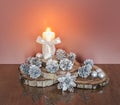Christmas Decoration with Burning Candle and Silver Cones