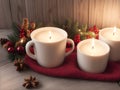 Christmas decoration with burning candles a red fabic and christmas ornaments on a wooden table Royalty Free Stock Photo