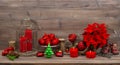 Christmas decoration with burning candles red flowers