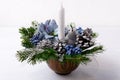 Christmas decoration with candle and blue silk poinsettias Royalty Free Stock Photo