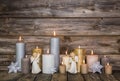 Christmas decoration with candles and angels on wooden background. Royalty Free Stock Photo