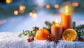 Christmas decoration with candles and oranges on snow background Royalty Free Stock Photo