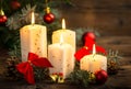 Christmas decoration with candles on the wooden table Royalty Free Stock Photo