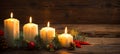 Christmas decoration with candles on the wooden table Royalty Free Stock Photo