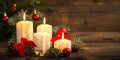 Christmas decoration with candles on the wooden table Royalty Free Stock Photo