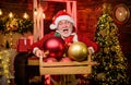 Christmas decoration. Cheerful celebration. Decorating home. Santa Claus. Mature man with white beard. Christmas spirit