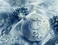 Christmas decoration. Christmas ball, pine cones, glittery jewels on white satin. Royalty Free Stock Photo