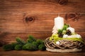 Christmas decoration - christmas composition with wreath and candles on the wooden background. Royalty Free Stock Photo