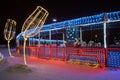 Christmas decoration of the city park with colorful lights imitating a festive train. Night shooting Royalty Free Stock Photo