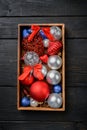 Christmas decoration collection, in wooden box , top view flat lay, on black wooden table background Royalty Free Stock Photo